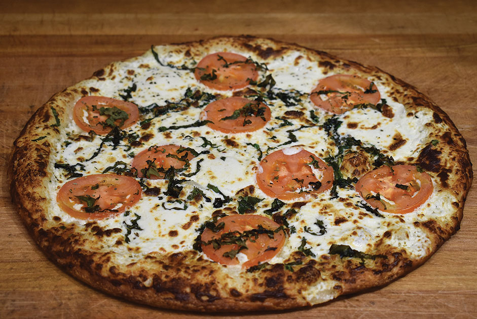 Pie Guys Pizza Back to Normal with Extraordinary Pizza Forsyth Woman